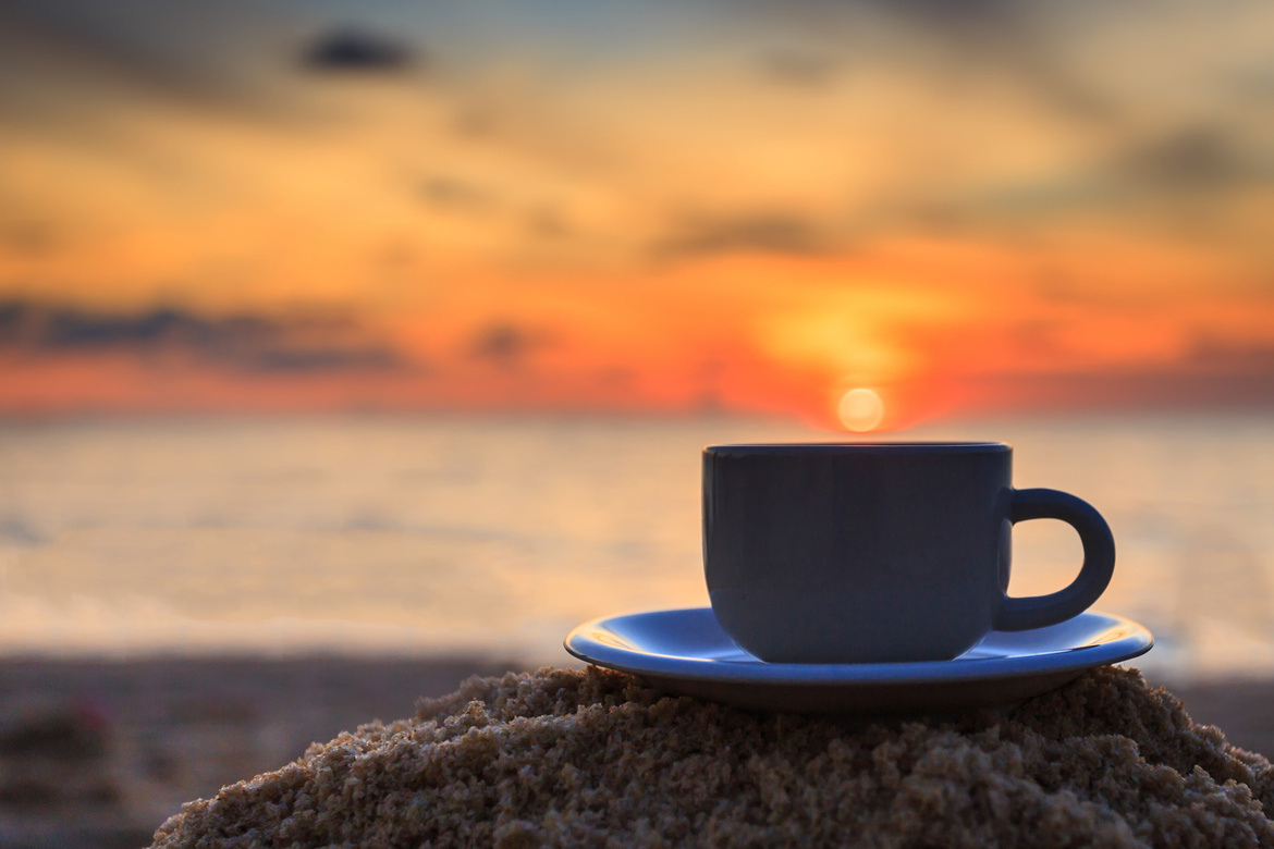 Coffee cup and sunset